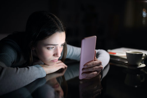 rsz unhappy teen girl staring at mobile phone RESIZED